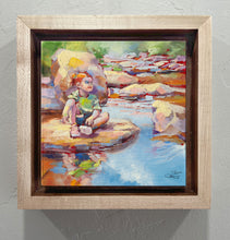 Load image into Gallery viewer, Framed painting of a child by a creek with a wooden frame.