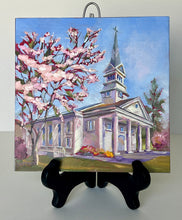 Load image into Gallery viewer, Original oil painting titled Greenbrier Chapel in Spring by Pat Cross. The painting rests on a black display easel.