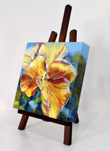 Load image into Gallery viewer, Sunny Petunia original oil painting on display easel facing left by Pat Cross.

