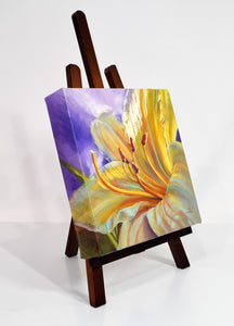 Yellow Stella Lily original oil painting on easel facing right by Pat Cross.